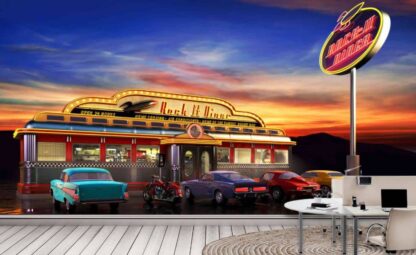 Retro Diner Wallpaper, as seen on the wall of this office, is a wall mural with vintage cars parked under a neon sign at a 50s themed American diner from About Murals.