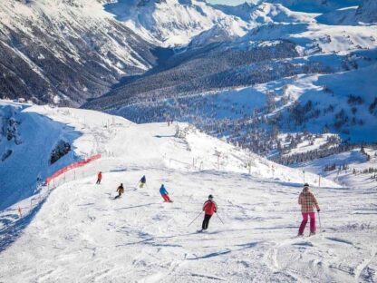 Whistler Ski Wallpaper is a photo mural of people skiing down Whistler Mountain in BC, Canada from About Murals.