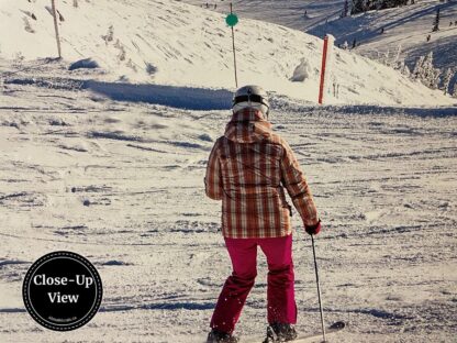 A close-up of a female skiier in a Whistler Ski Wallpaper from About Murals