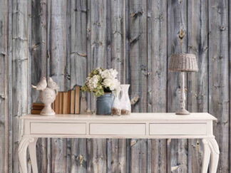 Wood Grain Wallpaper, as seen on the wall of this grey rustic room, is a photo mural of grey wood planks full of texture, grain, knots and cracks from About Murals.