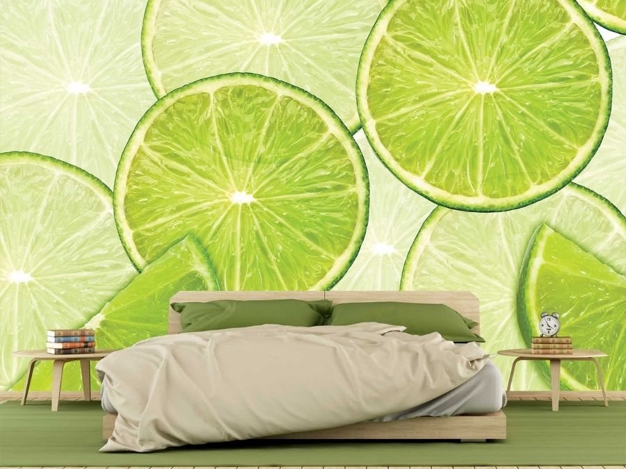 Lime Wallpaper, as seen on the wall of this bedroom, is a fruit mural of green lime slices on a white background from About Murals.