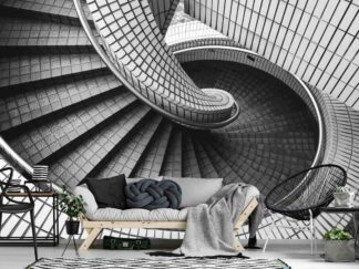 Spiral Staircase Wallpaper, as seen on the wall of this living room, is a black and white photo mural of stairs with square tiles in a building from About Murals.