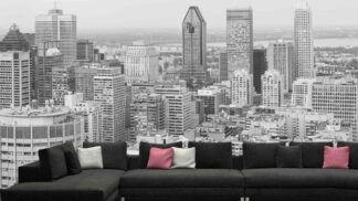 Montreal Skyline Wallpaper, as seen on the wall of this living room, is a black and white photo mural of skyscrapers and high rise buildings in Quebec from About Murals.