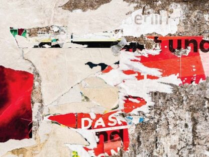 Graffiti Print Wallpaper is a photo mural of torned posters graffiti on a distressed wall from About Murals.
