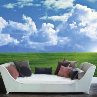 Field Wallpaper, as seen on the wall of this living room, is a photo mural of a cloudy sky in the valley over green grass from About Murals.