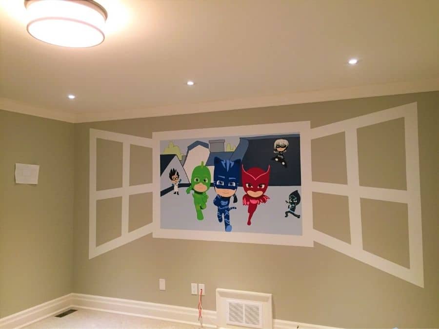 A painted mural in Beamsville, ON of characters from PJ Masks in a kids bedroom created by muralist Adrienne of About Murals.