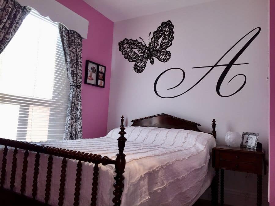 A painted mural in Milton, ON of a black butterfly and the letter "A" created by muralist Adrienne of About Murals.