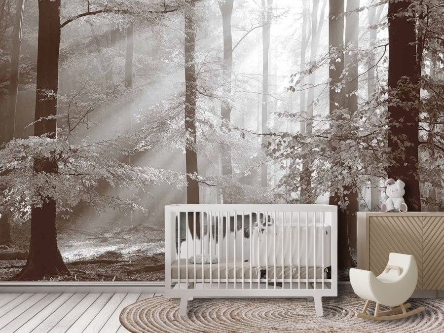 Brown Autumn Wallpaper, as seen on the wall of this nursery, is a photo wall mural of sunshine streaming through brown trees with textured leaves in a fall forest from About Murals.