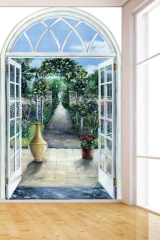 Garden Path Wallpaper, as seen on the wall of this room, is a mural with doors opening to a stone walkway leading to a floral arch, plants and flowers from About Murals.