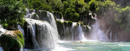 Large Waterfall Wallpaper is a realistic photo wall mural of waterfalls in Croatia surrounded by a green natural landscape from About Murals