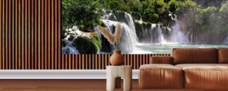 Large Waterfall Wallpaper, as seen on the wall of this living room, is a photo mural of natural falls spilling into a pool of turquoise water from About Murals.