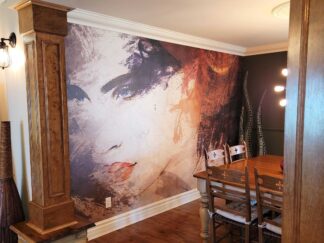 Abstract Woman Wallpaper, as seen on the wall of this dining room, is a mural of a beautiful woman's face with a watercolor texture from About Murals.