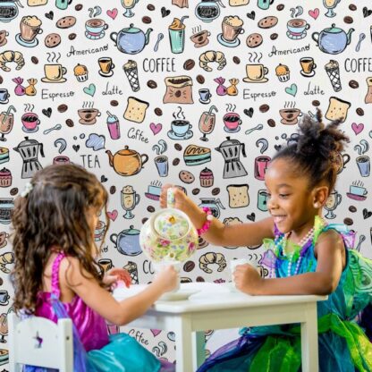 Coffee Wallpaper, as seen on the wall of this play café, is a mural with a cute design of coffee cups, mugs, tea pots, coffee beans, cupcakes, lattes and pie on a light background from About Murals.