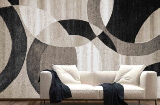 Large Circle Wallpaper, as seen on the wall of this living room, is a wall mural with black, beige and brown interlocking circles in a fabric texture from About Murals.