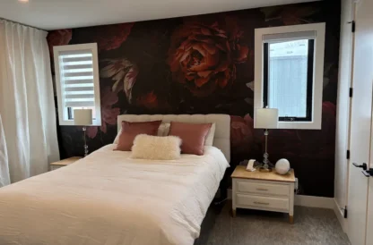 Dutch Floral Wallpaper, as seen on the wall of this bedroom, is a wall mural that creates a moody, romantic feeling from About Murals
