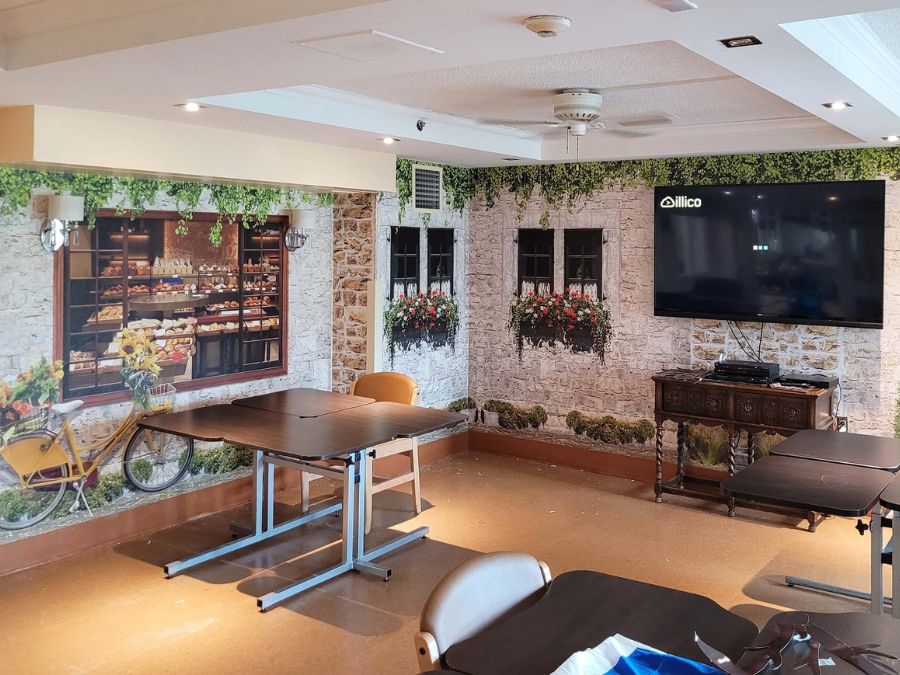 Care home wallpaper, like this bakery scene in a dining room, can make your facility feel less institutional.