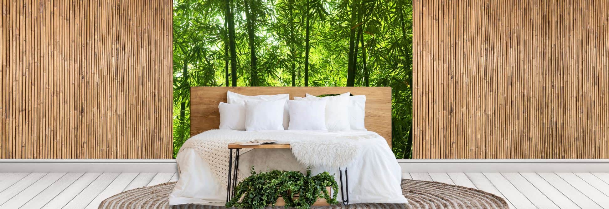 Bamboo Wallpaper, as seen on the wall of this bedroom, is a wall mural featuring green trees in a forest flanked with bamboo wood sticks on either side of the feature wall from About Murals