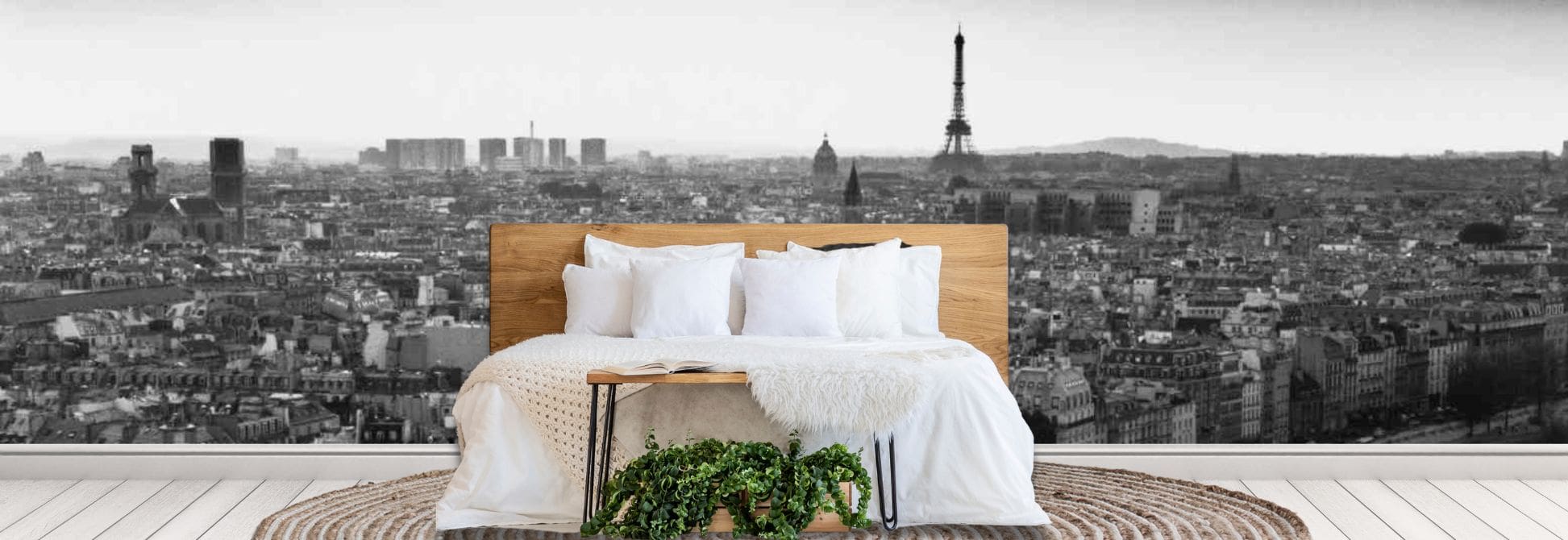 Europe city wallpaper mural, as seen on the wall of this bedroom, is a photo wall mural of the Eiffel Tower towering over a Paris cityscape from About Murals