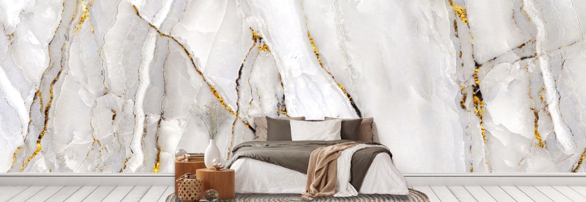 Marble wallpaper, as seen on the wall of this bedroom, is a photo wall mural with a white marble wall with luxurious gold veins from About Murals.