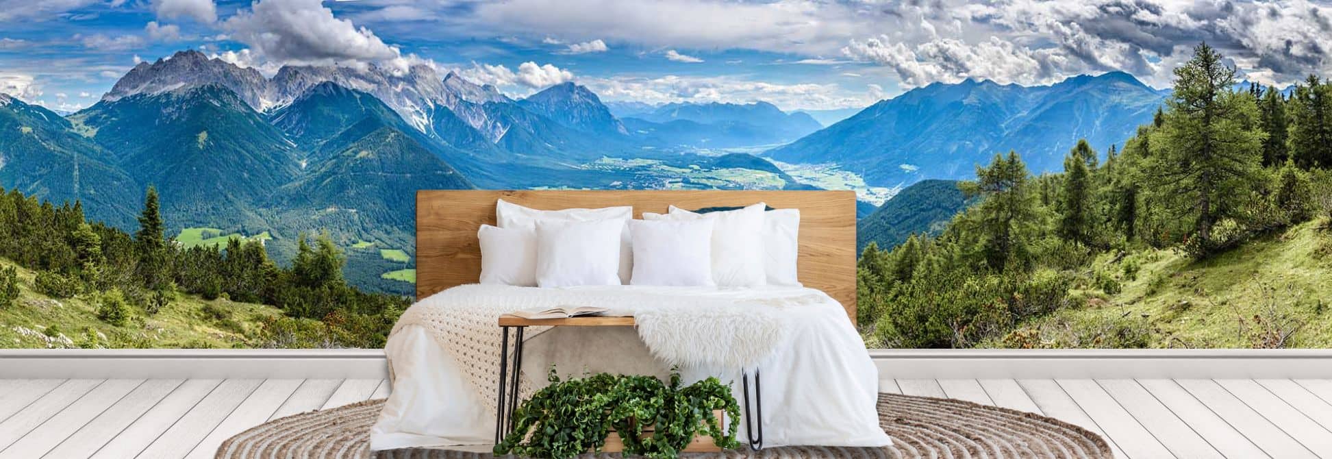 Mountain Wallpaper, on the wall of a bedroom, is a photo wall mural with snow-capped peaks and rugged landscape scenery from About Murals.