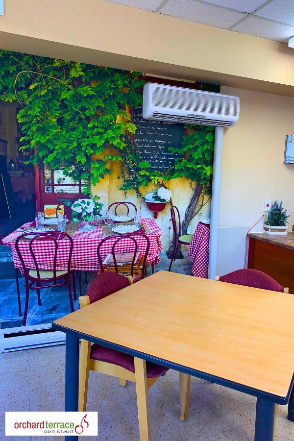 Restaurant interior wallpaper, featuring a Paris cafe scene with a menu, in Stoney Creek, ON, Canada from About Murals.