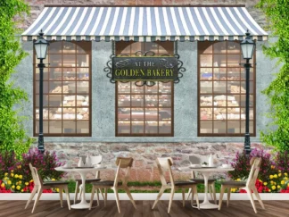 Bakery Shop Wallpaper, as seen on the wall of this cafe, is a wall mural of an old style bakery storefront with cobbled stone, vintage lamp posts and flowers under windows looking in to a bakery filled with sumptuous cakes, pastries and bread from About Murals